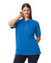 A blue polo shirt worn by a model, featuring a collar, short sleeves, and a logo on the chest.