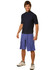 Men's surf shorts in purple, made from 100% polyester with a peach finish, featured on a model. Includes a logo.