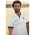 A white polo shirt with black detailing and a logo, featuring short sleeves and a collar.