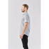 A grey men's short-sleeve button-up shirt displayed on a model from the side. The shirt features a pocket and has a branding logo.