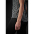 A close-up of a women's black and grey striped Pacifica tee, featuring a sleek design and a branded logo.