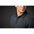 A close-up of a men's black and grey striped polo shirt featuring a collared neck and buttons. The shirt has a label.