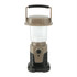A mini camping lantern in tan and black, featuring a handle and a push button. It has a logo on the base.
