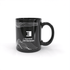 A black coffee mug with a white abstract design and a handle, featuring a logo on the front.