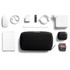 A black tech kit surrounded by a white power bank, mouse, charging cables, a stylus, AirPods, and a USB drive.