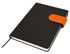 A black A5 notebook with an orange closure band, featuring an elastic strap and a ribbon bookmark.