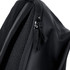 A close-up of a black backpack featuring a zip and mesh detailing. The material appears durable and water-resistant.
