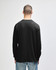 A black long sleeve t-shirt displayed on a model, featuring a simple design and a logo on the back.