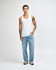 A model wearing a white unisex fine jersey tank top paired with dark cargo pants and sneakers.
