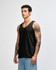 A unisex fine jersey tank in black, featuring a relaxed fit and a simple design. It has a logo on it.