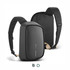 A black sling bag with adjustable straps and a logo, featuring a sleek design and a padded compartment.