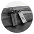 A zip detail of a black Moleskine Metro Slim Backpack featuring dual zippers and a textured surface.