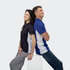A black and white women's polo shirt and a blue and white men's polo shirt are displayed on two models standing back to back.