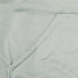 A close-up of a light green fabric featuring a seamless pocket, part of a hoodie design.