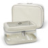 A cream-coloured cosmetic bag with a transparent front and silver zippers. It features a logo on the surface.