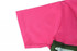 A bright pink sports jersey with a green decorative element, featuring a logo on the fabric.