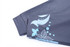 A dark grey jacket sleeve with a blue floral design and a logo.