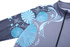 A school wear jacket in grey with blue floral and abstract patterns, featuring a zip closure and a high collar.