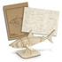 A wooden shark model with a light beige finish, accompanied by a cardboard template and assembly instructions.