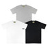 A set of three essential tees in grey, white, and black, each with a tag featuring a logo.