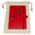 A beige drawstring bag containing a red journal and a red pen, featuring a logo.