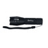 A black torch with a textured grip and a wrist strap, featuring control dials and a branding logo.