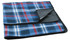 A blue and red checkered picnic rug with a black backing, featuring a fold-over edge and a logo.