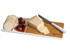 A bamboo cheese board with cheese slices, crackers, olives, and a knife, featuring a white and natural wood design.