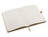 An open A5 notebook featuring blank lined pages with a light cream colour and a ribbon bookmark.