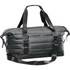 A quilted duffle bag in dark green, featuring adjustable straps and a zippered pocket. It has a logo on it.