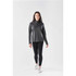 A long sleeve, quarter-zip jumper in dark grey, paired with black leggings and white sneakers, featuring a logo.