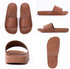 Brown slippers featuring a single strap and a textured sole, displayed from multiple angles. Includes branding on the insole.