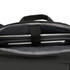 A black backpack interior featuring a sleek laptop compartment and grey lining. It includes a brand logo.
