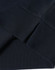 A dark navy crew neck sweater featuring ribbed cuffs and hem, displaying a logo on the fabric.