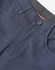 A pair of men's flexi chino pants in navy, featuring a button closure and pockets, with branding visible.