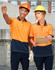 Two individuals in hi-vis orange and navy safety polos, wearing hard hats and safety glasses, stand together outdoors.
