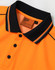 An orange safety polo shirt with black collar and buttons, featuring a tag with care instructions.