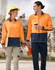 Two people walk side by side, wearing a hi-vis orange and navy blue long-sleeve polo shirt and safety gear.