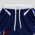 Custom youth active shorts in navy blue with white and red accents, featuring an elastic waistband and drawstring.