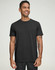 A men's premium cotton short sleeve tee shirt in black, featuring a logo on the chest, worn by a smiling model.