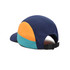A multicoloured 8-panel cap in navy, orange, and teal with an adjustable strap at the back.