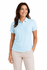 A woman wearing a light blue polo shirt with a collar and buttons, paired with cream-coloured pants.