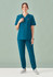 A model wearing a teal women's scrub top and matching pants, featuring a logo, against a light background.