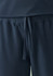 A pair of navy unisex scrub pants with an elastic waistband and drawstring detail. Features a logo.