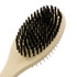 A pet grooming brush with a beige handle and black bristles, featuring a curved shape for comfortable use.