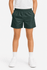 Kids' sports shorts in dark green with an elastic waistband and side pockets, paired with white shoes and socks.