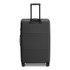 A large black suitcase with a retractable handle and wheels, featuring a smooth surface and an attached logo.