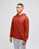 A hooded sweatshirt in a rich rust colour, featuring a front pocket and a logo on the sleeve.