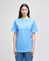 A blue short-sleeve T-shirt is displayed on a model, featuring a relaxed fit and a logo.