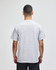 A grey short-sleeve t-shirt viewed from the back, featuring a simple design and a brand logo.